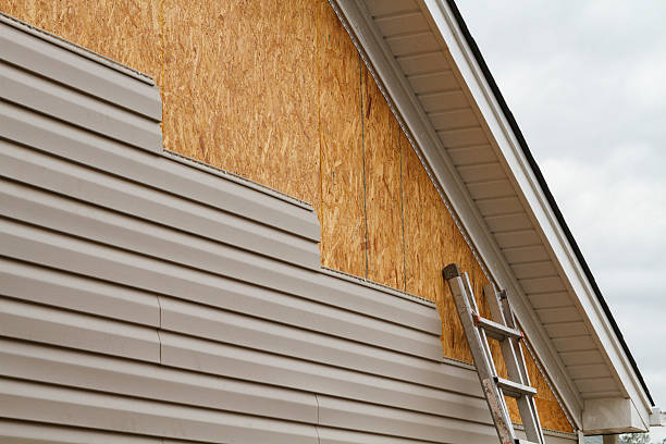 Professional Emergency Siding Repair technician working in Polk, OH